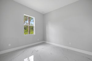 Bedroom 3 with large window for abundant natural light
