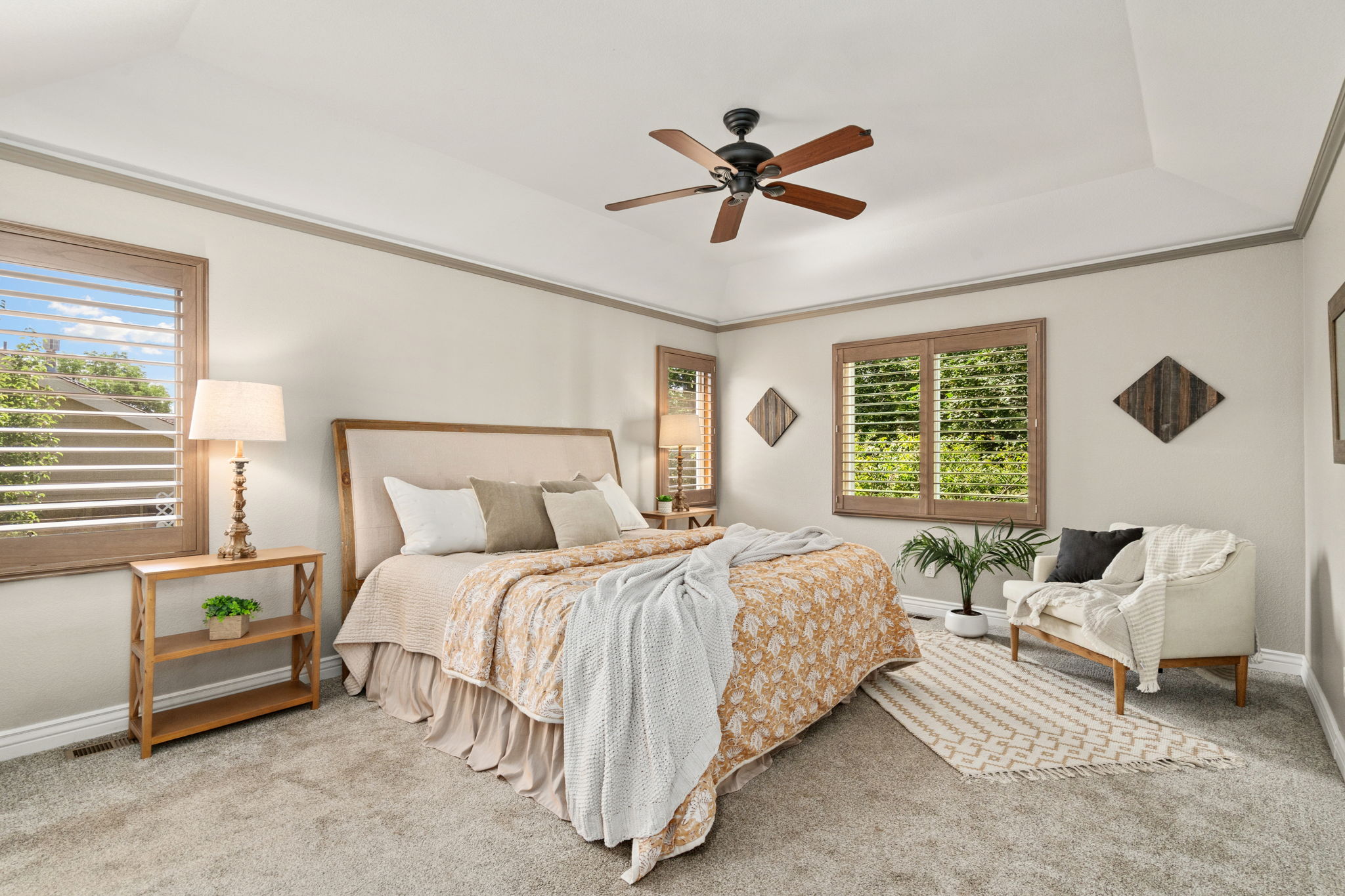 Main floor primary bedroom with beautifully updated ensuite bathroom and walk-in closet.