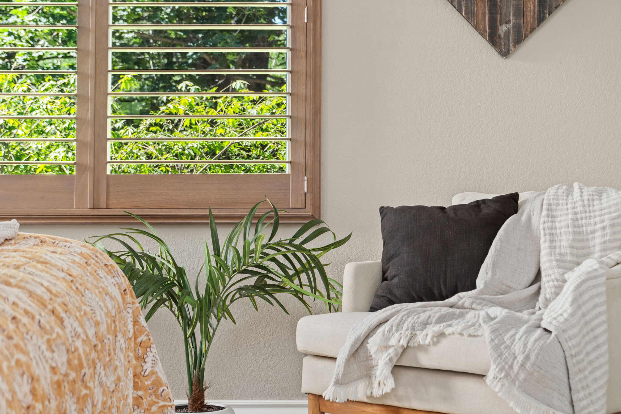 Custom shutters in primary bedroom and living room.