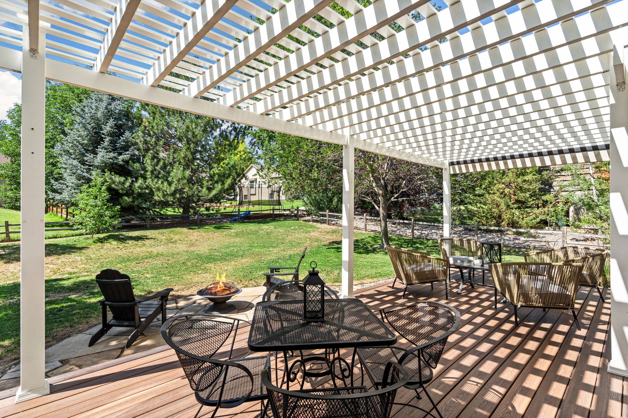 Just off the kitchen is the expansive deck overlooking the backyard of the near 1/4 acre lot