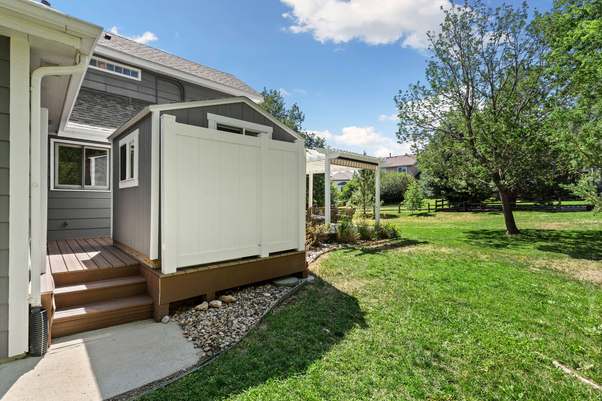 Separate enclosed patio currently home to the included backyard shed but also comes with the option to hook up a hot tub here.
