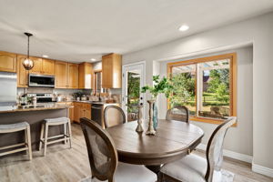 The eat-in kitchen flows well to the amazing outdoor space.