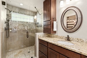 Spacious walk-in shower in main level primary bathroom