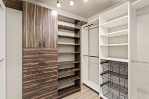 Custom primary bedroom closet organization