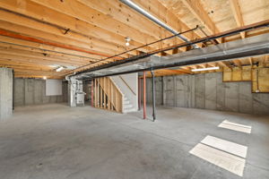 The unfinished basement has two big garden level windows right as you walk down the stairs that make for an extra bright basement. How will you use this space?