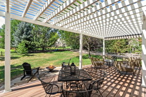 Just off the kitchen is the expansive deck overlooking the backyard of the near 1/4 acre lot
