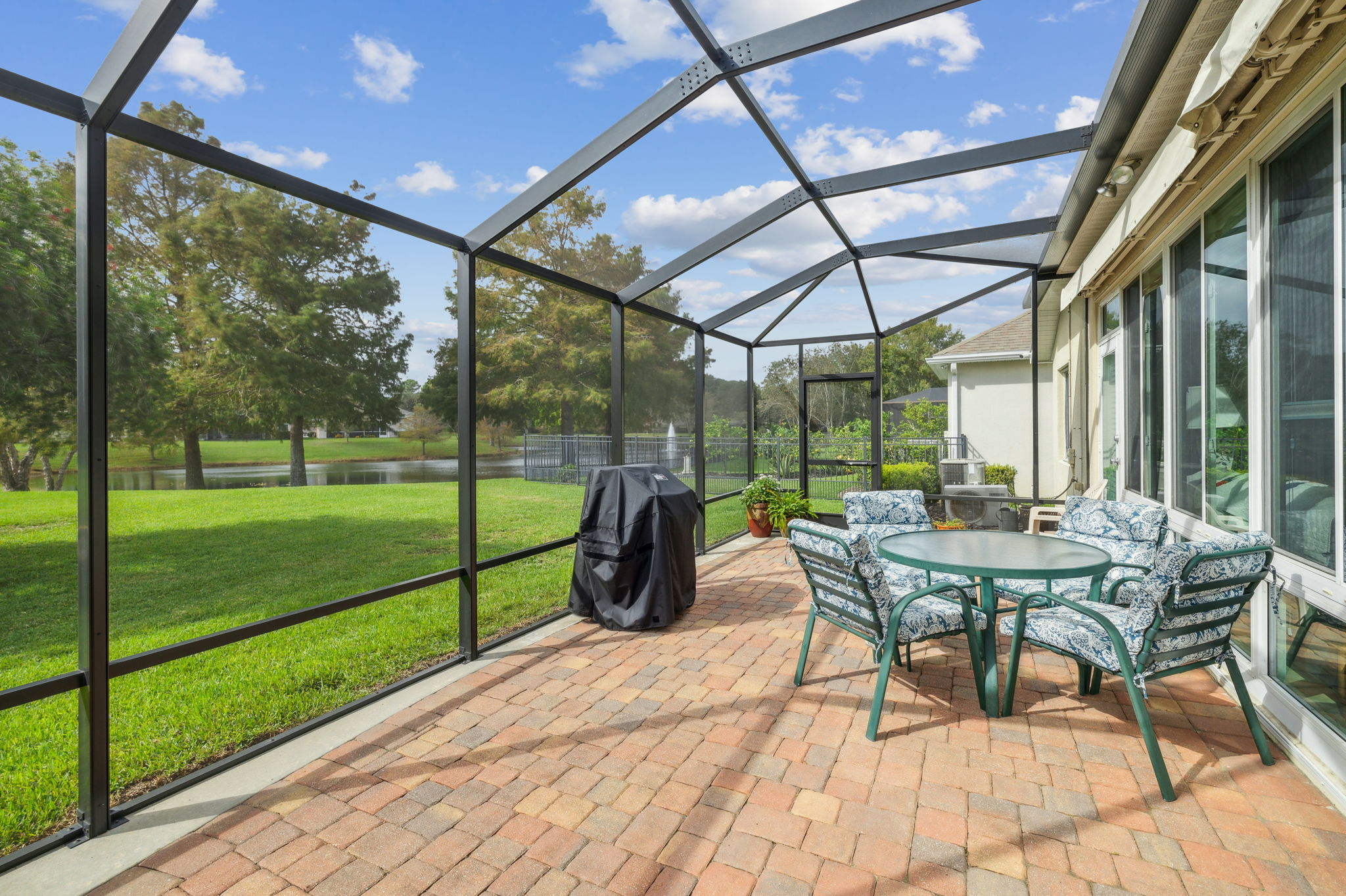 Screen Enclosed Paver Patio w/Pond View