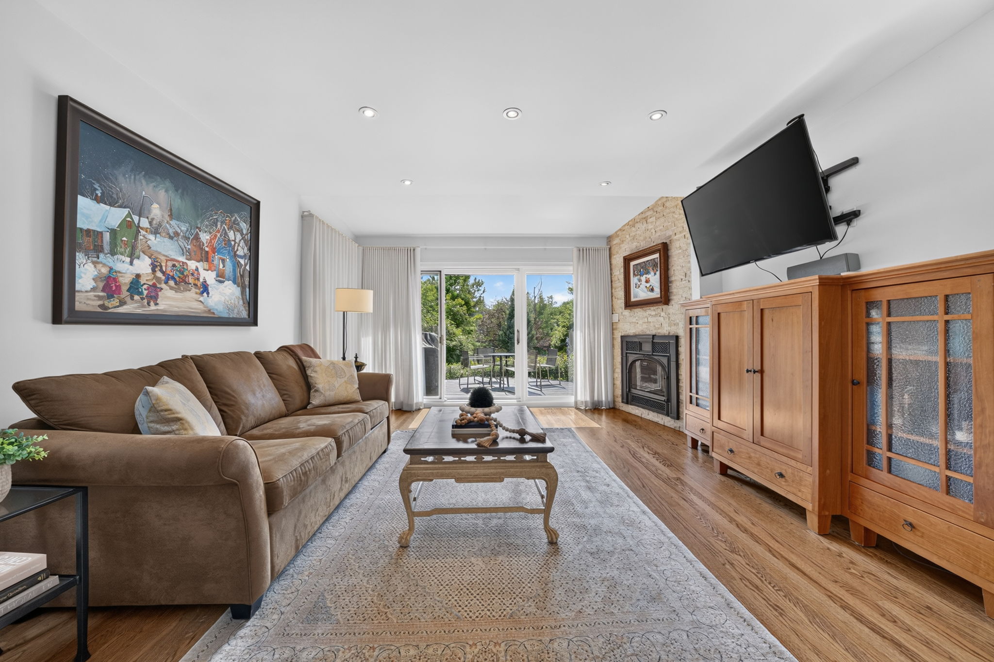 Sun-filled family room framed by garden views