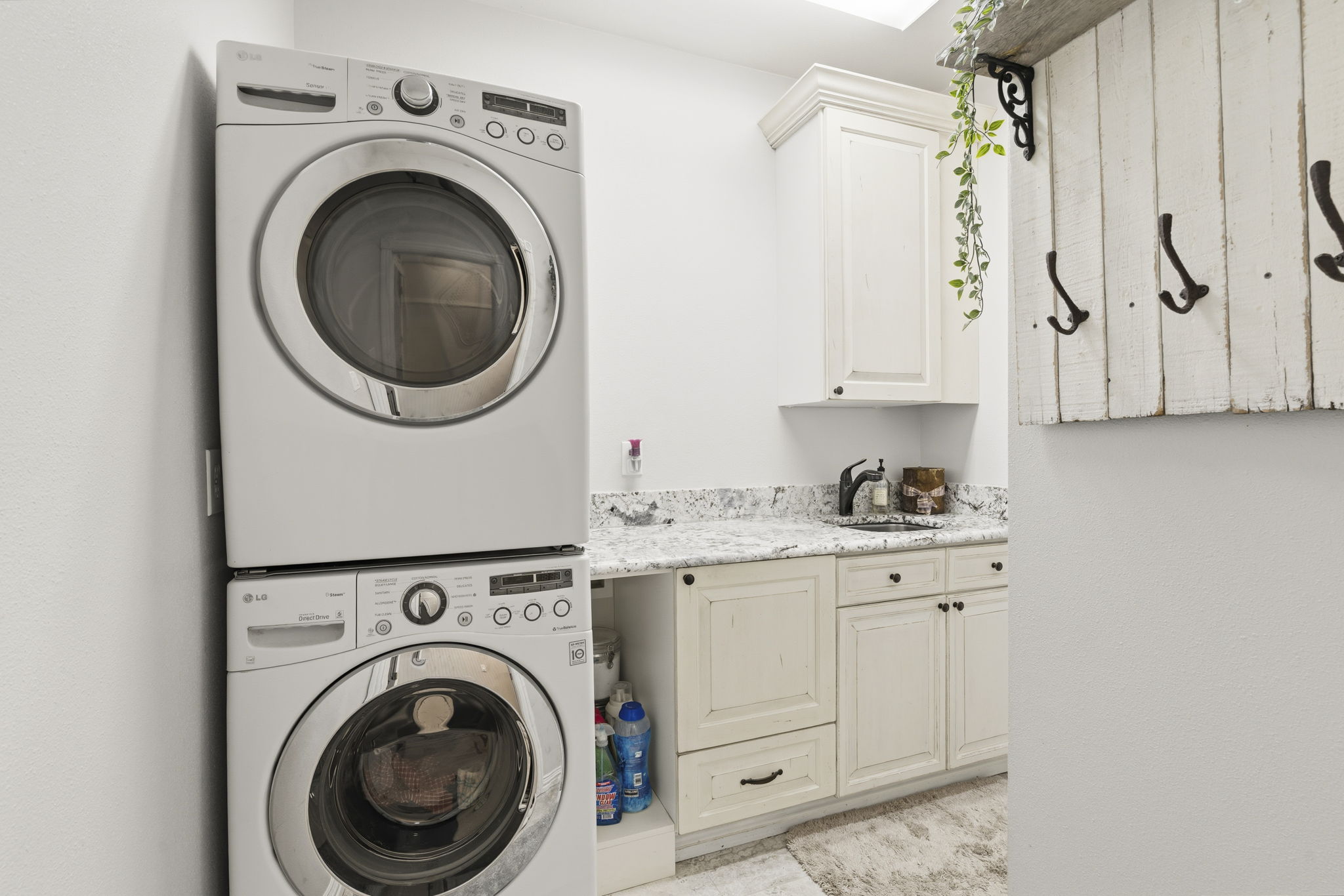 Main floor laundry room, complete with wash basin.