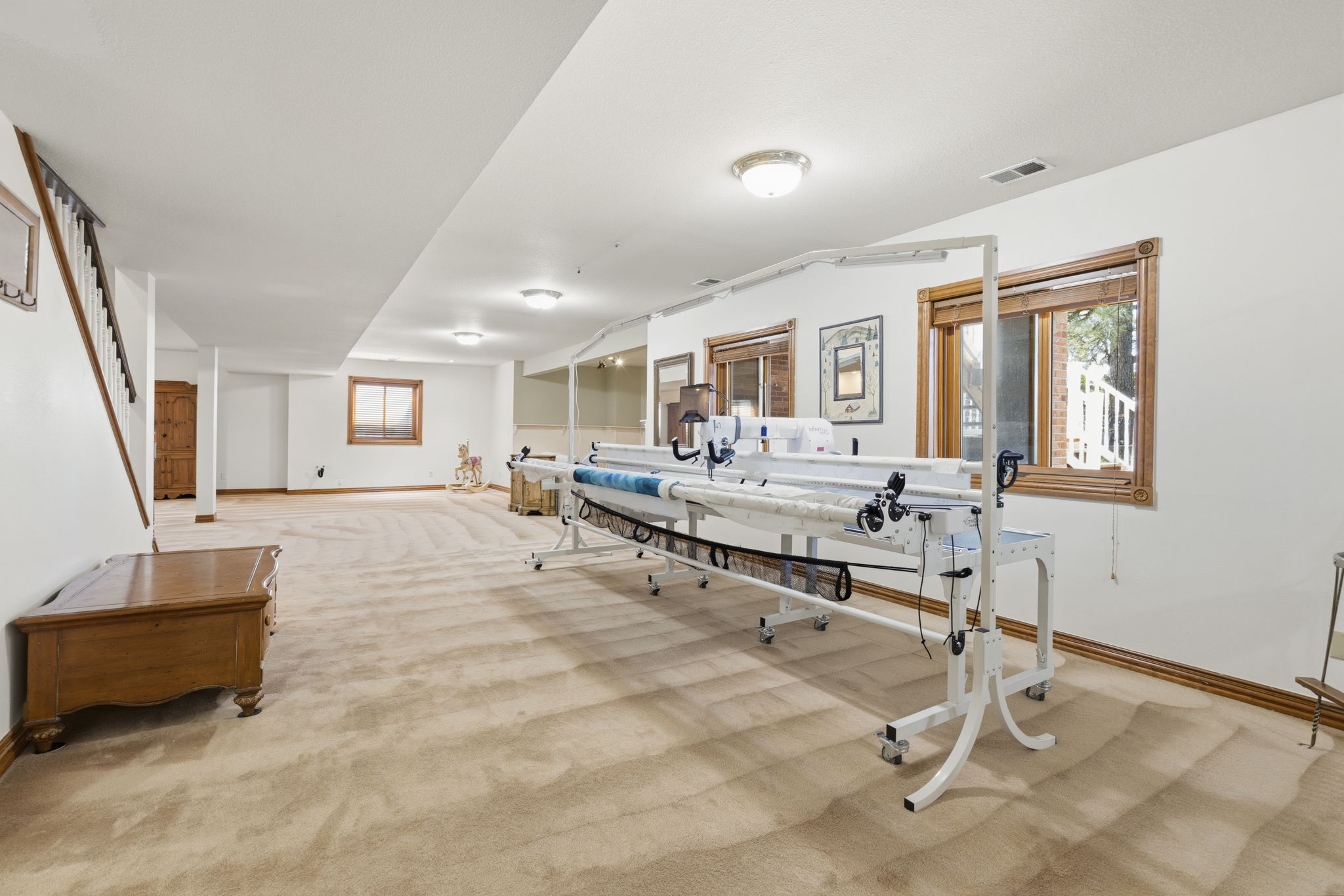 Large lower level main living area with plenty of natural light and space for entertaining.