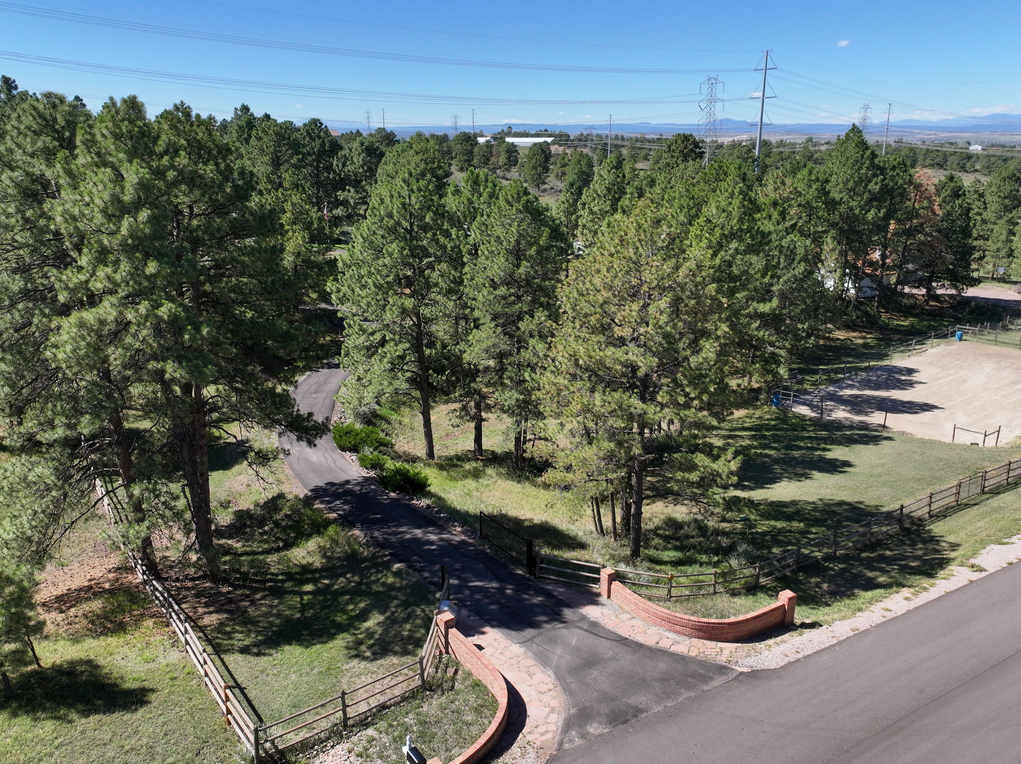 Private gated entry with long driveway to the residence.