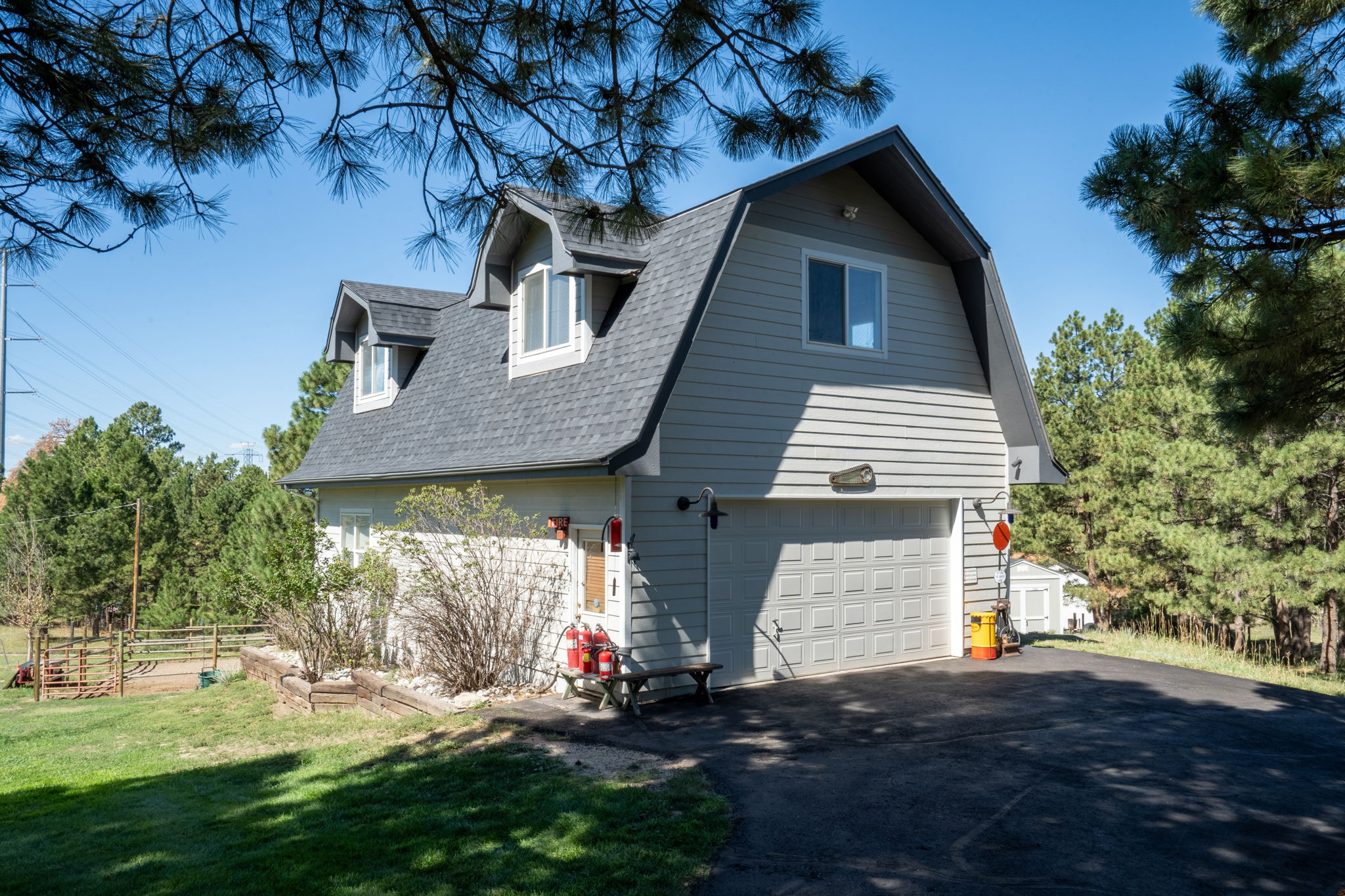 Detached 2 1/2 car garage/workshop with an upper floor private getaway perfect for a game room, home office, home gym or art studio.