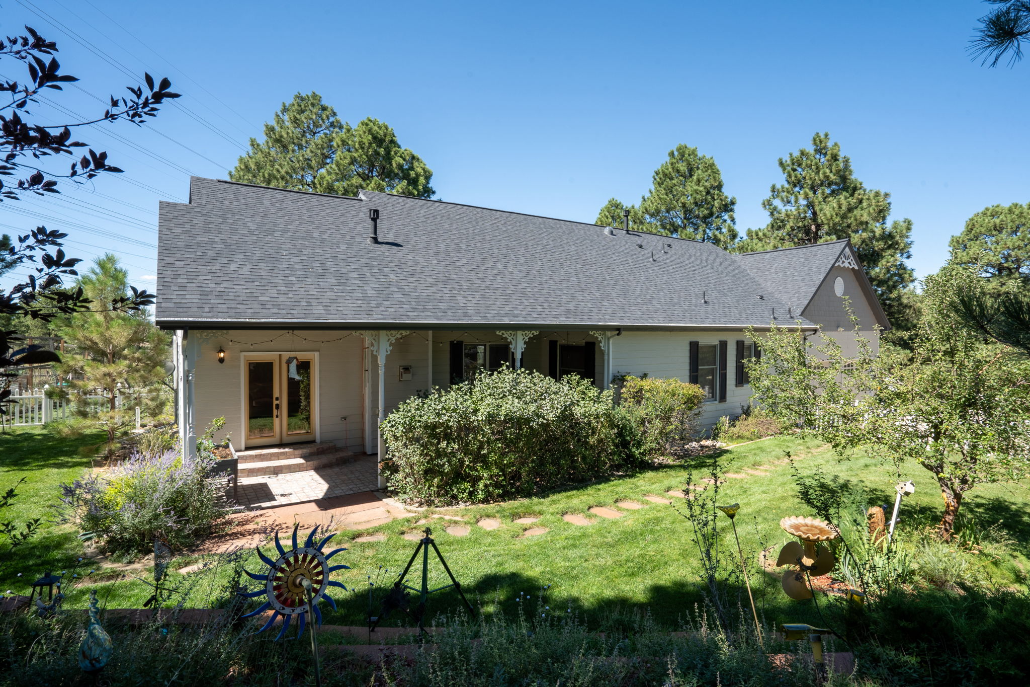 Who wouldn't want to take in the sun on this gorgeous brick paved back patio?
