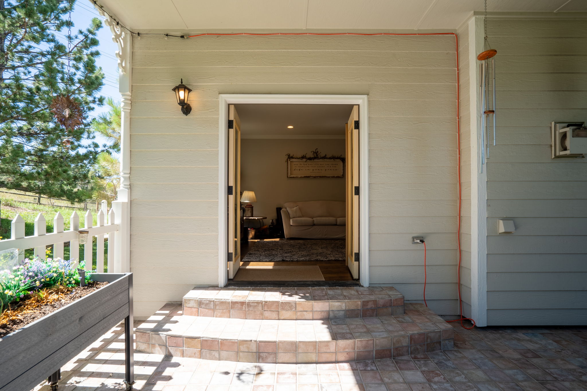 Who wouldn't want to take in the sun on this gorgeous brick paved back patio?