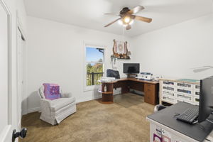 1 of 2 main floor secondary bedrooms currently being used as an office/sewing room.