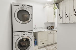 Main floor laundry room, complete with wash basin.