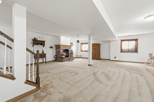 Large lower level main living area with plenty of natural light and space for entertaining.