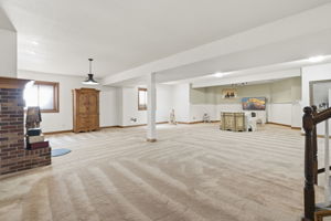 Large lower level main living area with plenty of natural light and space for entertaining.