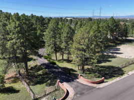 Private gated entry with long driveway to the residence.