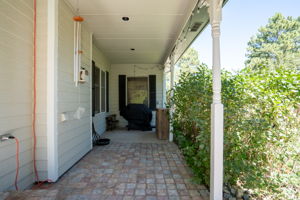 Who wouldn't want to take in the sun on this gorgeous brick paved back patio?