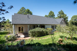 Who wouldn't want to take in the sun on this gorgeous brick paved back patio?