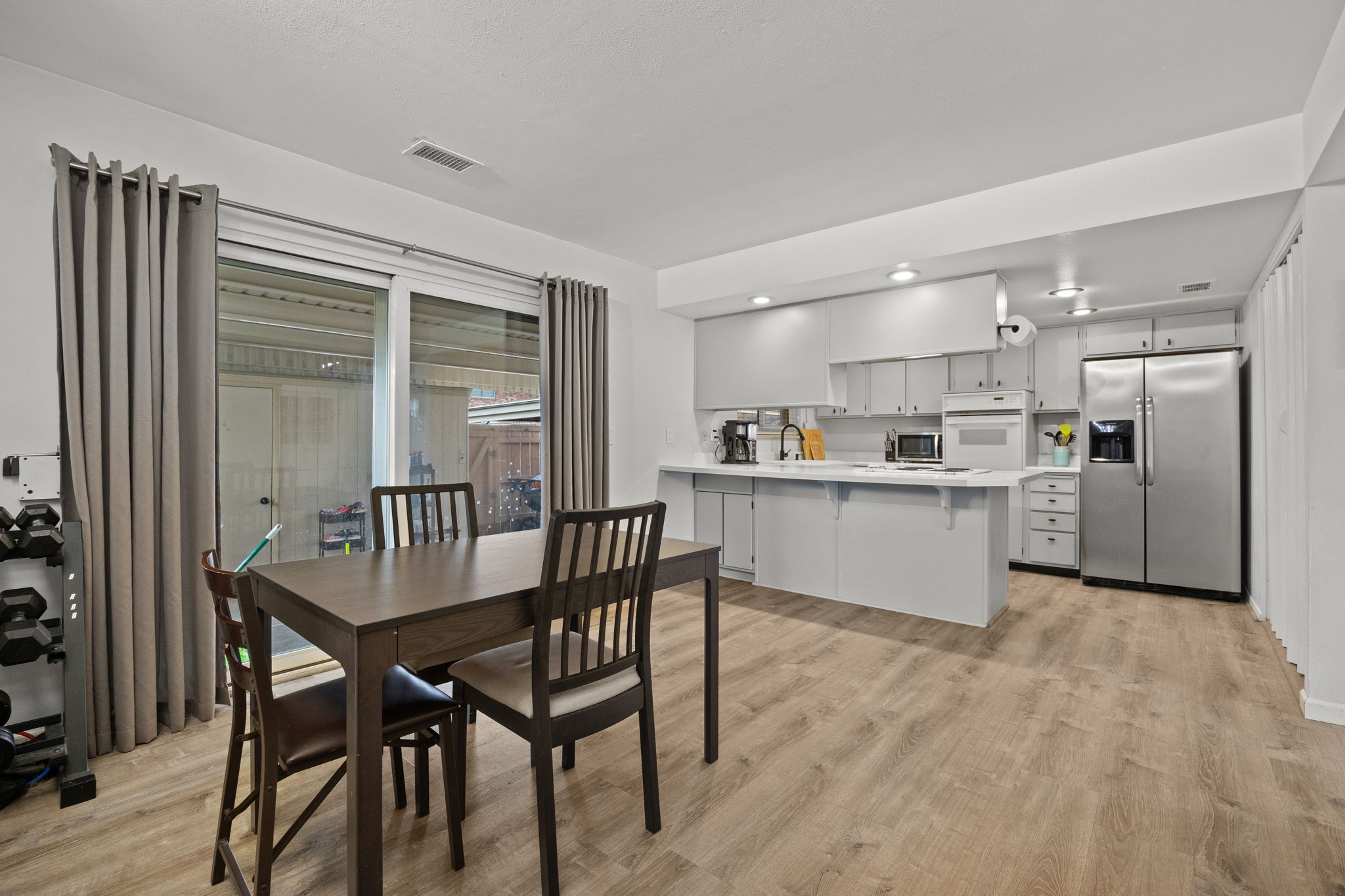 Kitchen & dining flow to covered patio