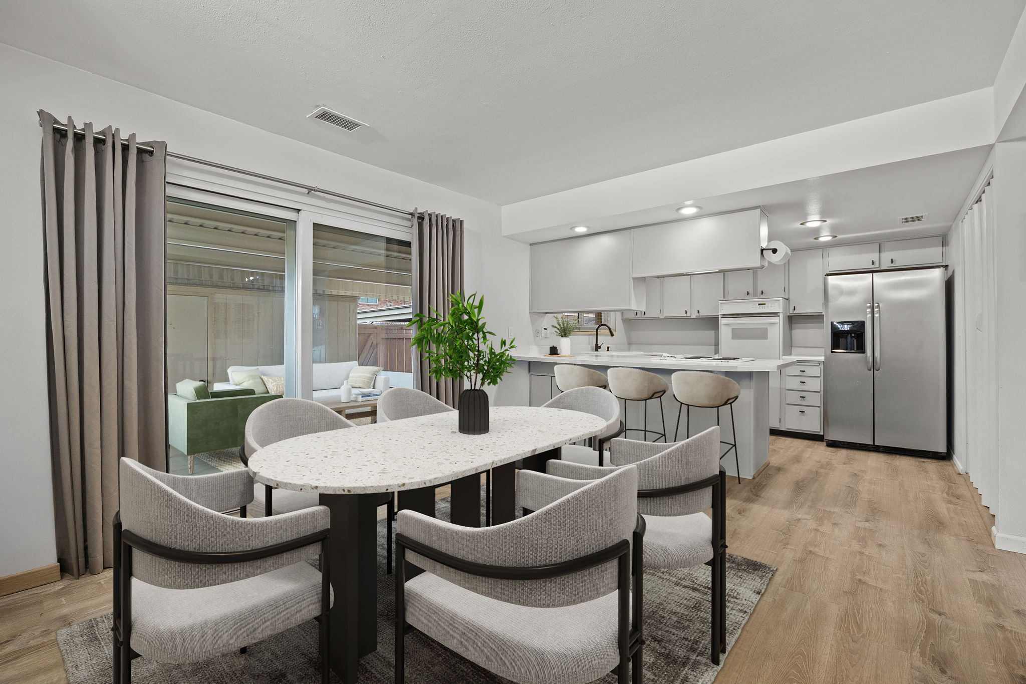 Kitchen & dining flow to covered patio