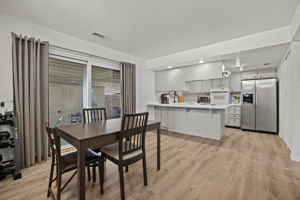 Kitchen & dining flow to covered patio