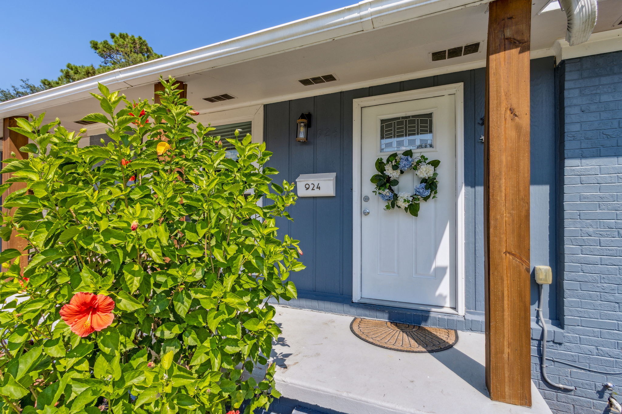 ... with a charming farmers porch and attractive painted brick exterior!