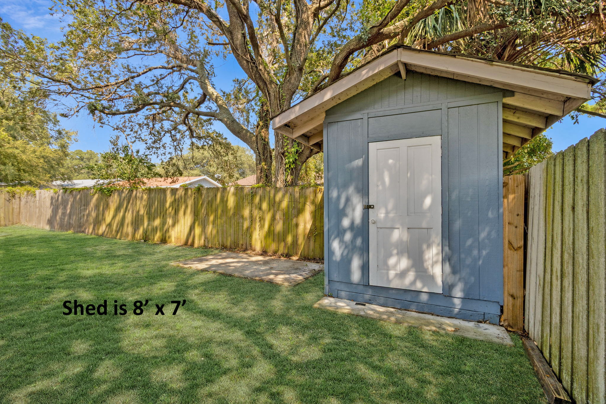 The rear yard also features a roomy shed for additional storage!