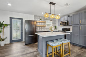 ... to an elegantly remodeled kitchen.