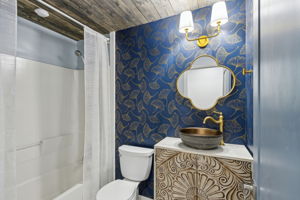... and the guest bath echoes the elegance of the master with its refined finishes and thoughtful details.