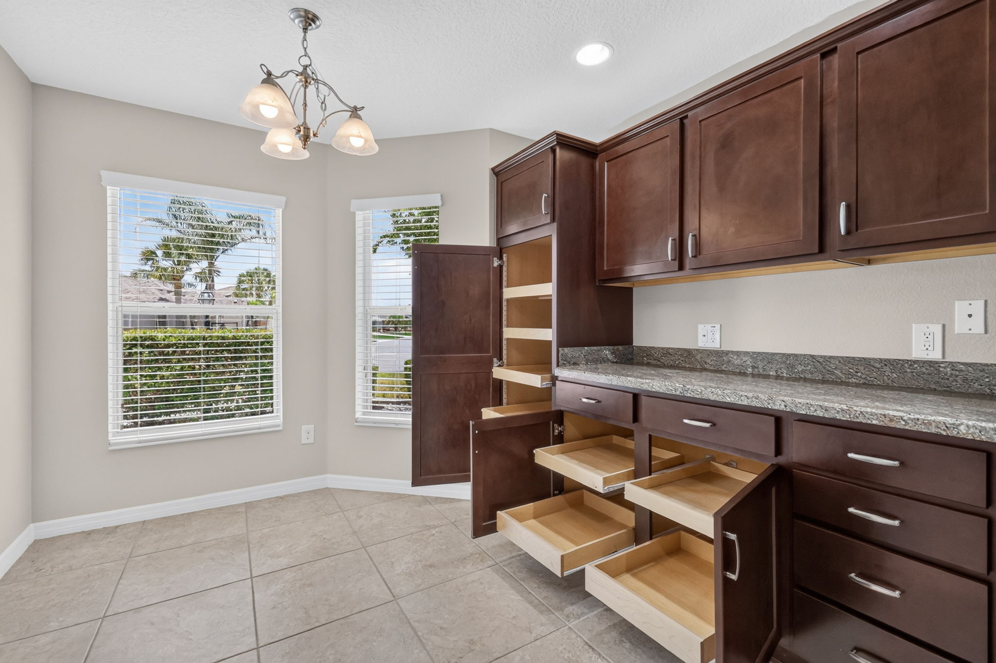 Kitchen and Dinette with Roll-Out Shelving and Dinette