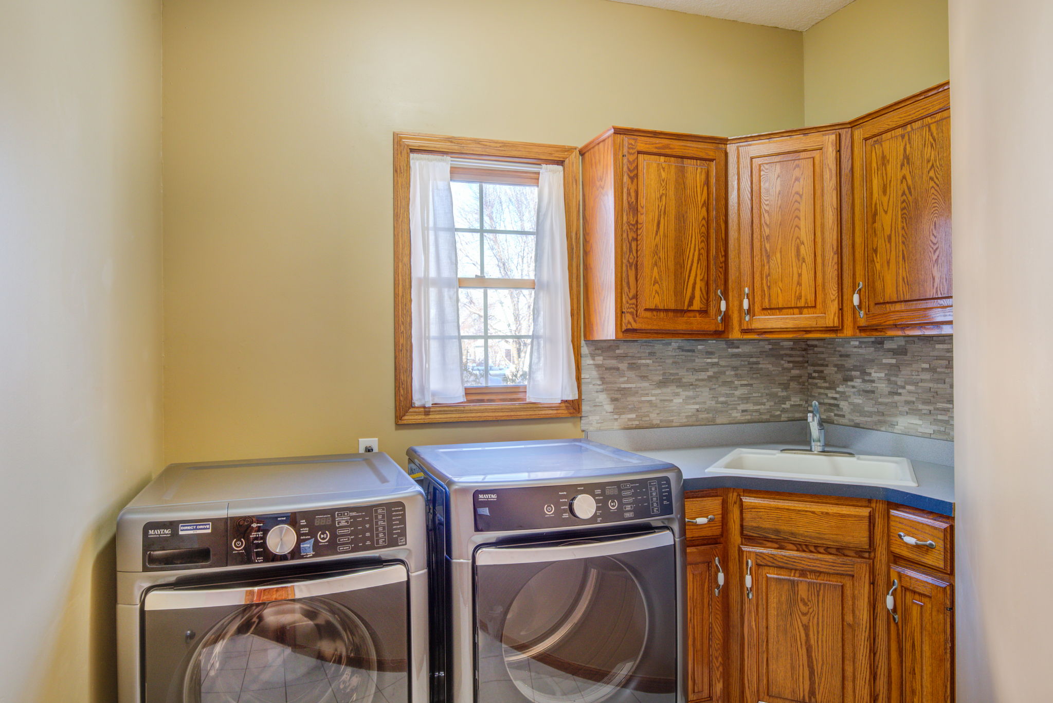 Laundry Room with Tile Backslash