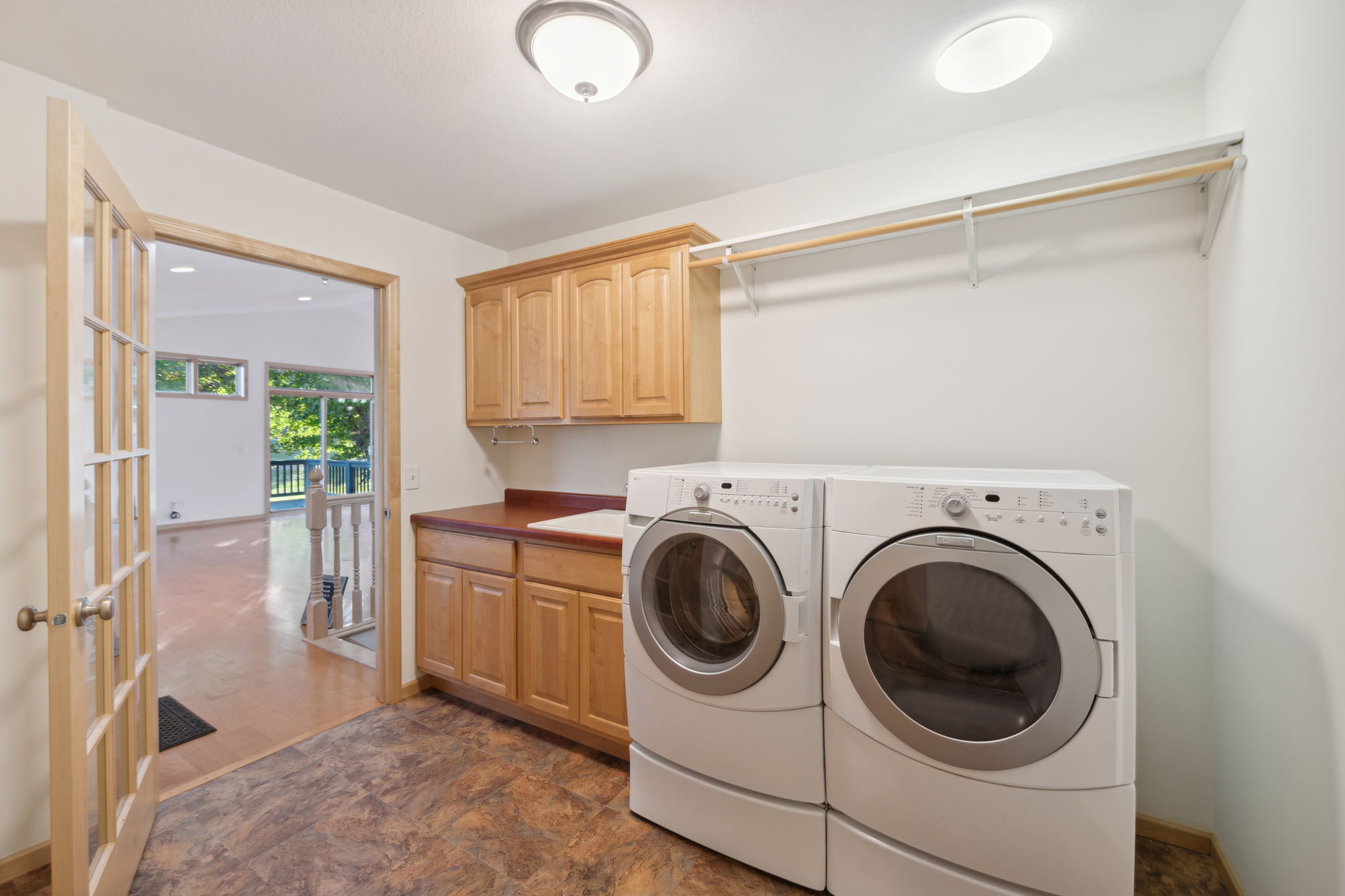 Handy laundry/mudroom just off the garage offers a great drop zone