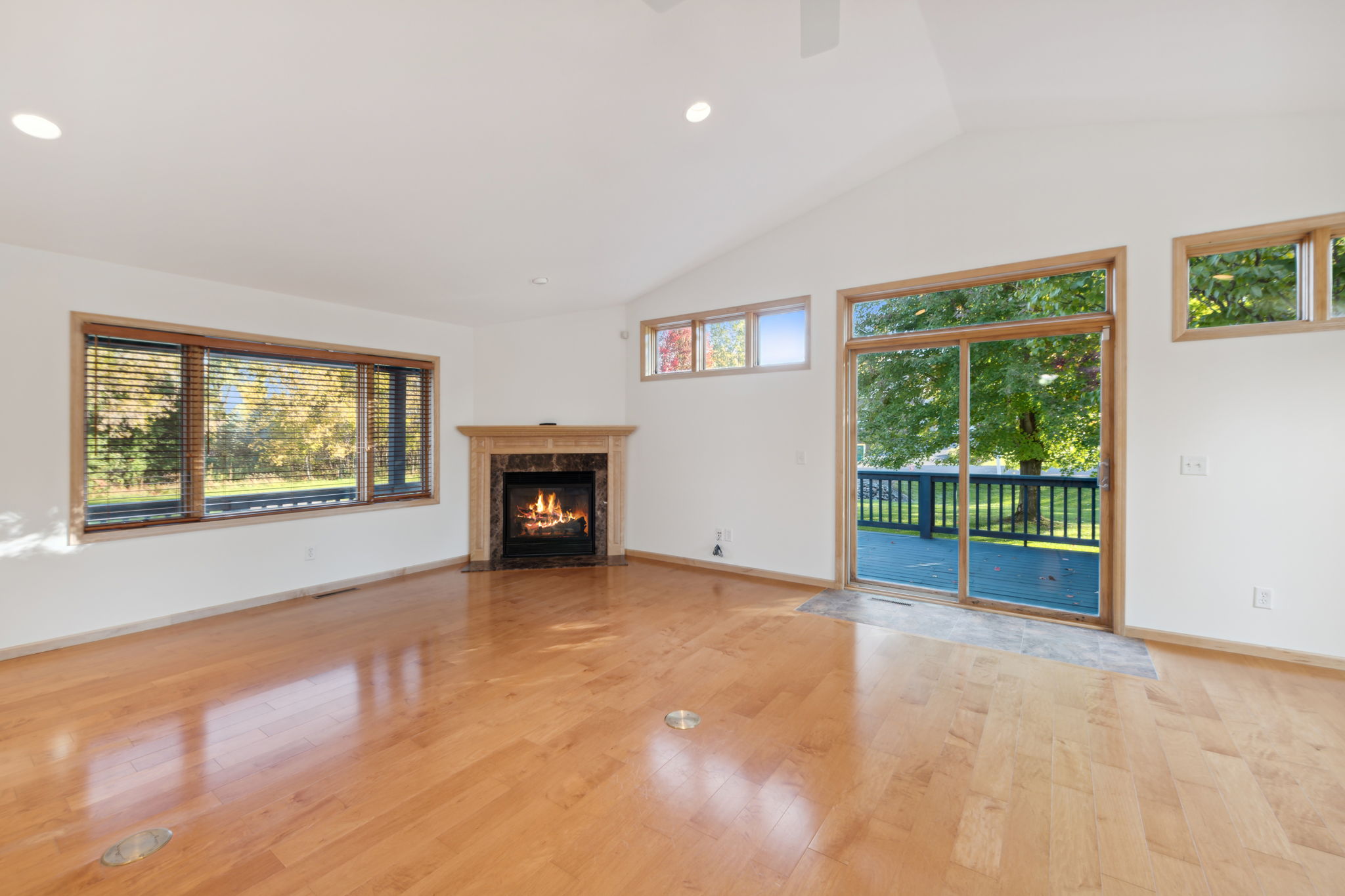 Enter to beautiful wood floors & a cozy gas fireplace