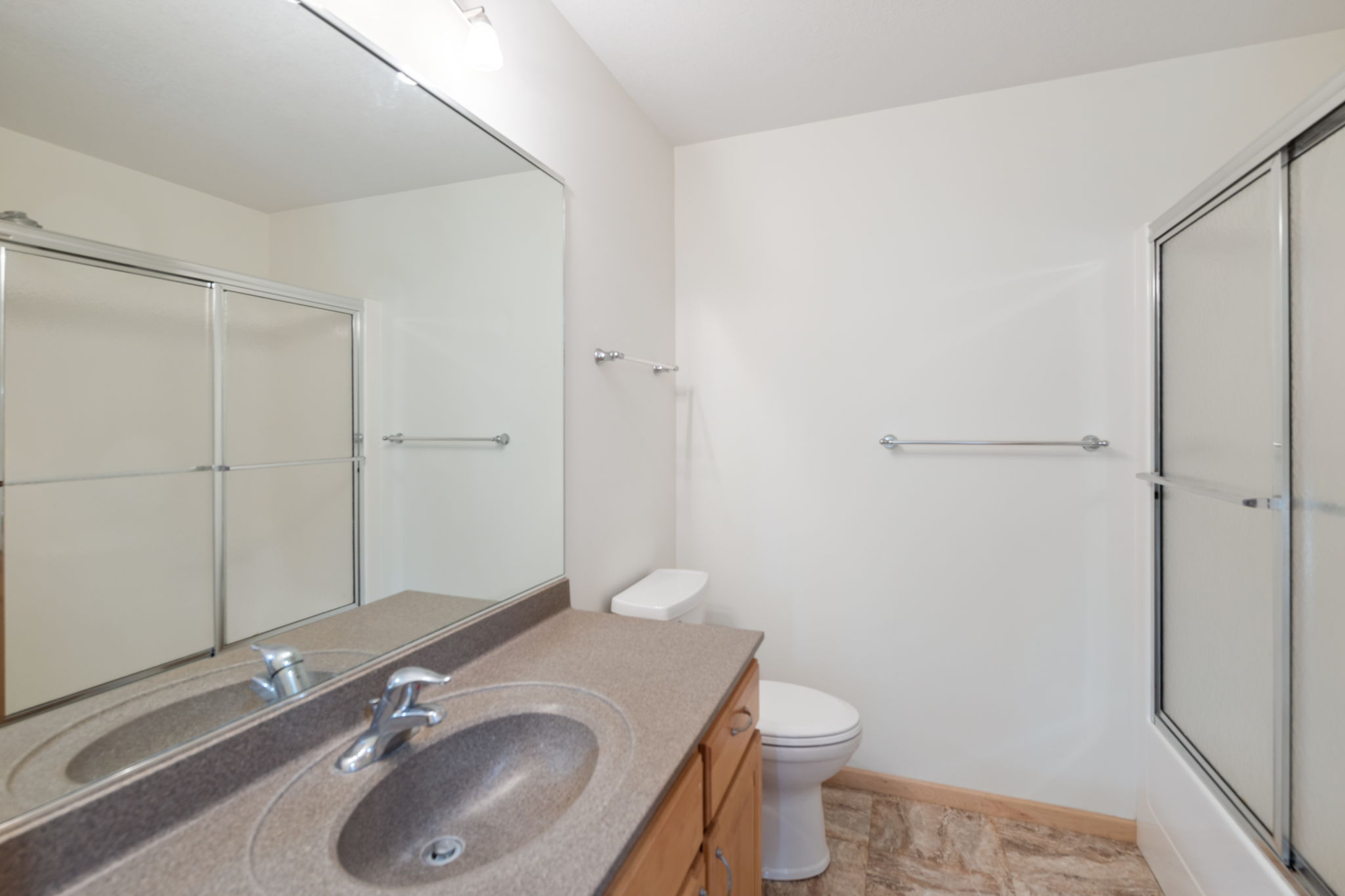 Main full bath located across from the 2nd main floor bedroom