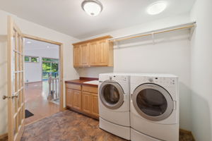 Handy laundry/mudroom just off the garage offers a great drop zone