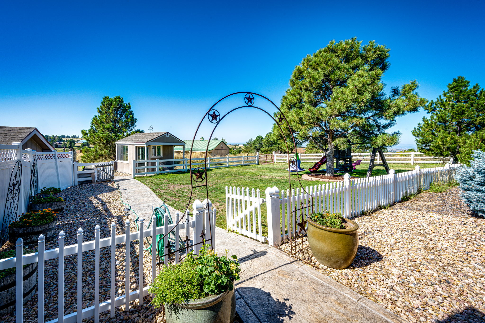 Fenced Front Yard w Play Set