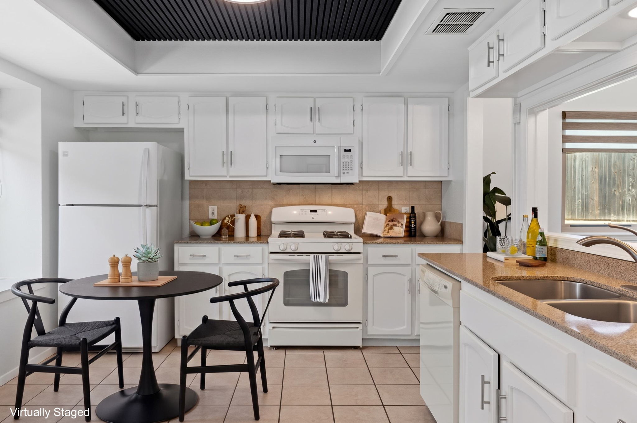 Virtually staged to show the eat-in kitchen possibilities!