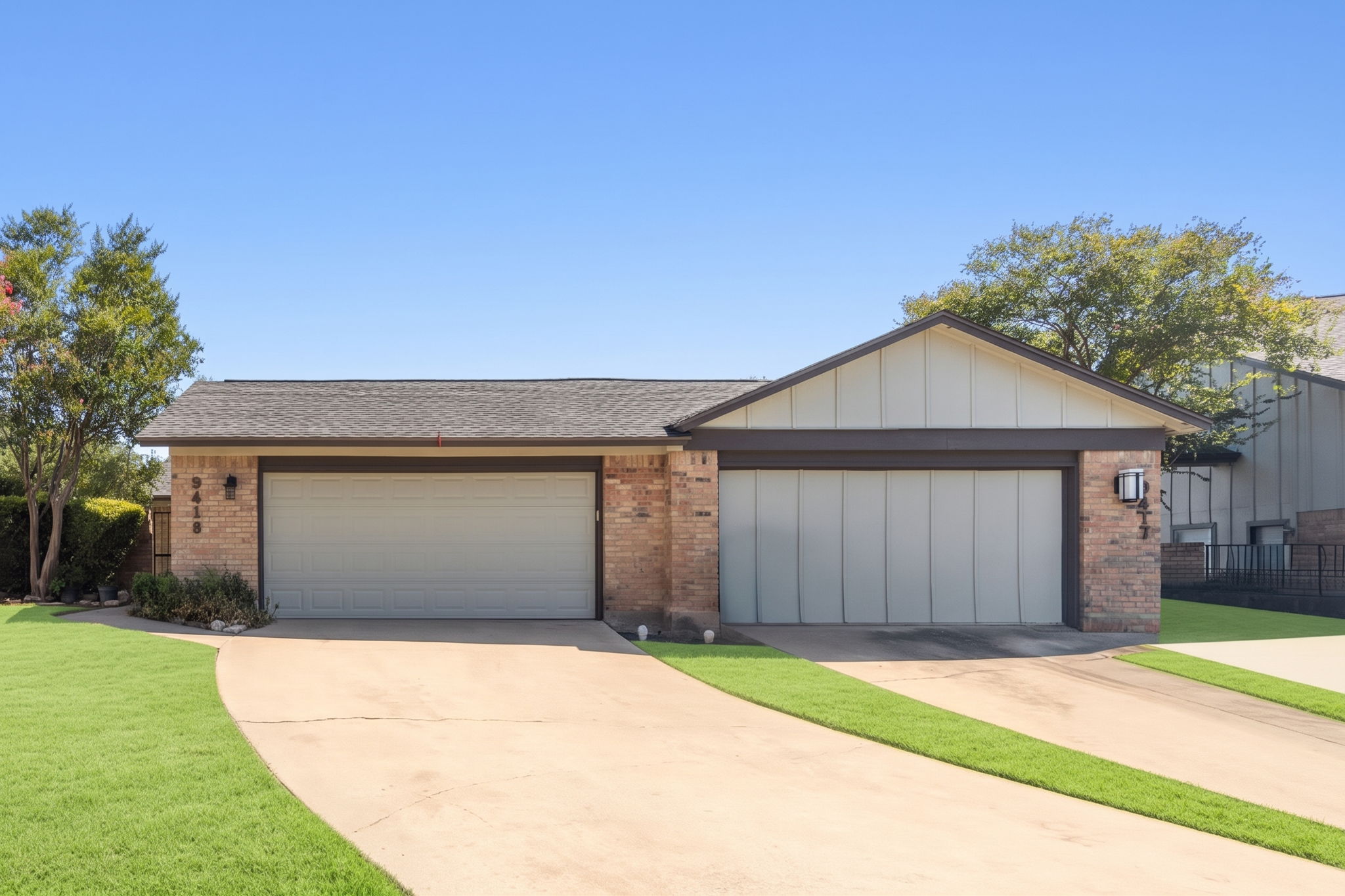 A nice wide driveway leads up to your two car garage. 9419's garage is the one on the left.