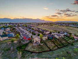 Aerial Back of Home with Mountains