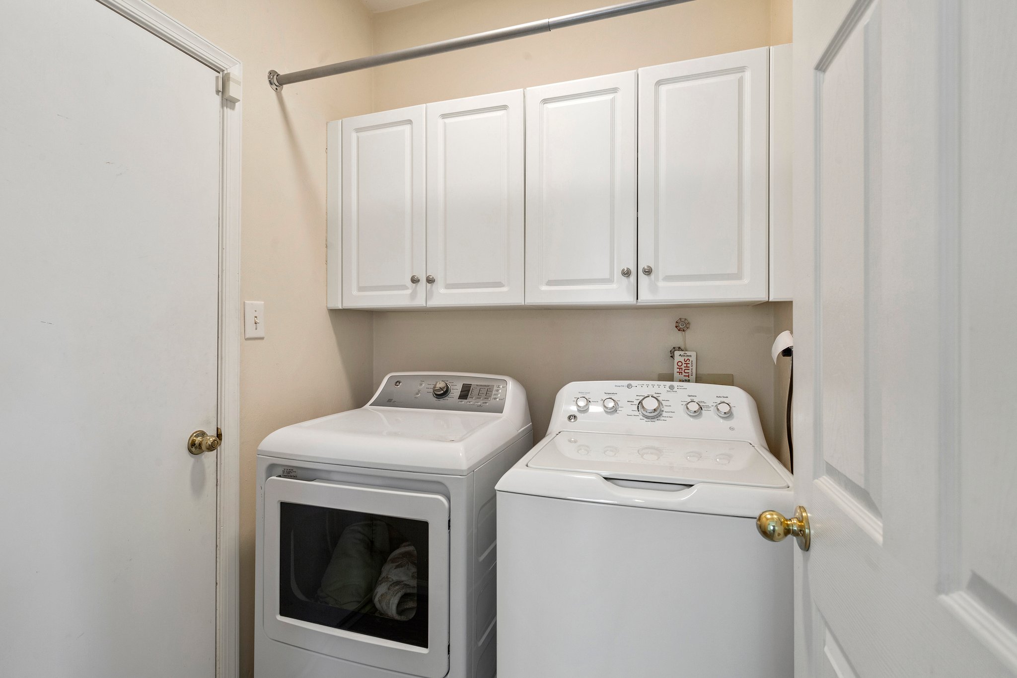 Functional laundry room with direct access to the garage for added convenience