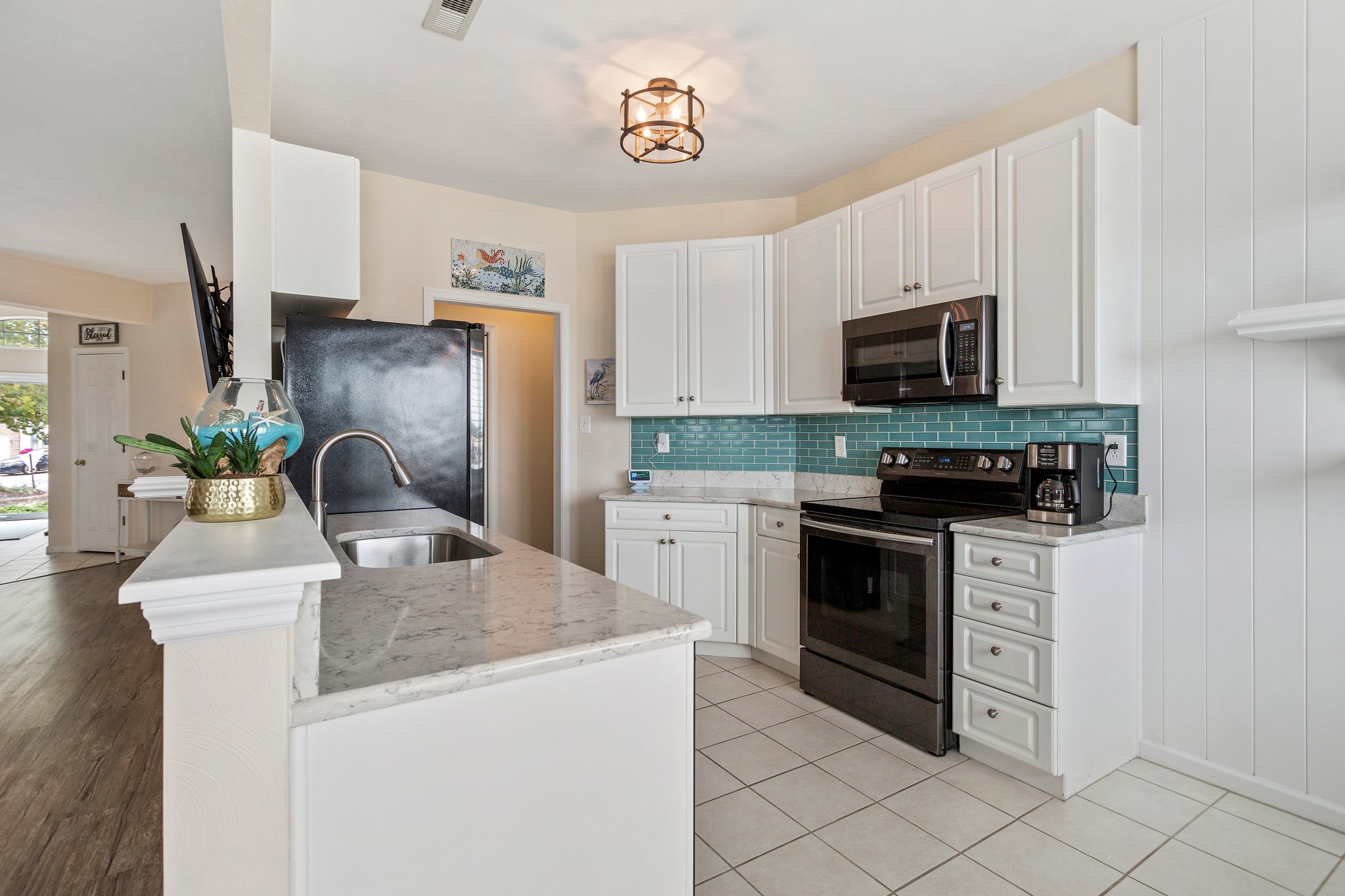 Charming kitchen with beautiful quartz countertops and timeless details