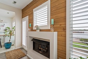 Chic accent wall complemented by a cozy gas fireplace, adding warmth and style to the space