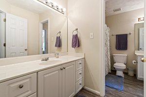 Updated bathroom off hallway and bedroom #3 featuring dual vanities and refreshed finishes