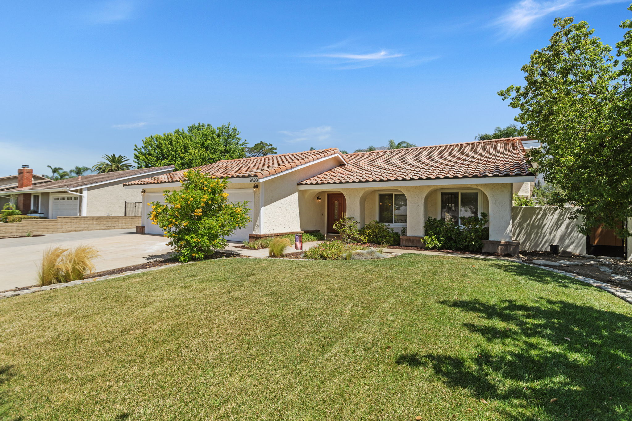 Large front yard with mature trees plenty of parking
