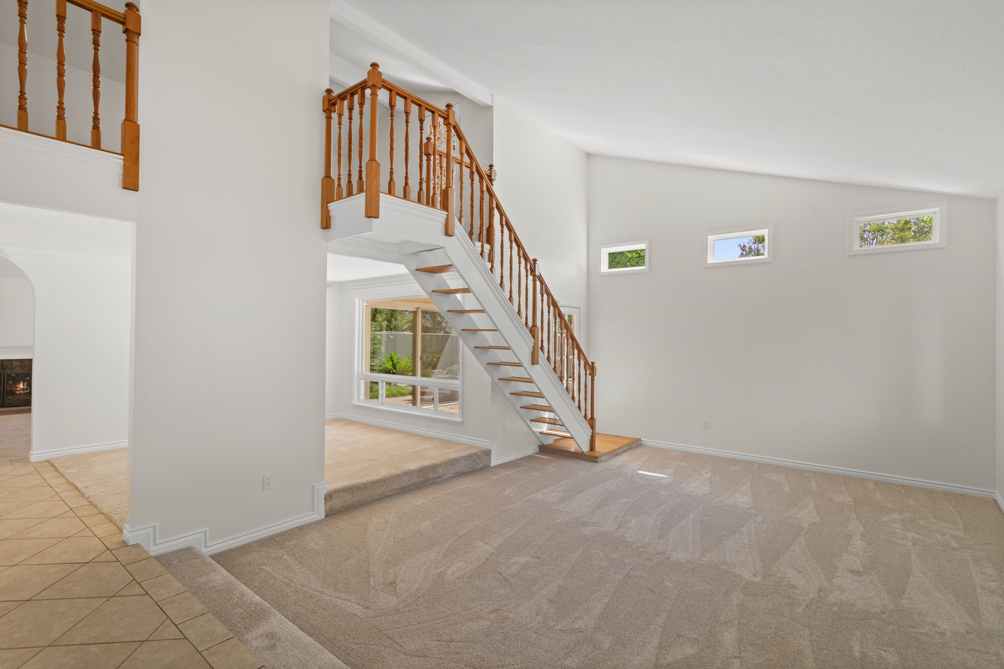 Formal Living Room with vaulted ceiling and plenty of light