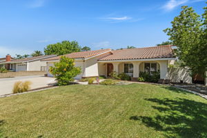Large front yard with mature trees plenty of parking