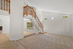 Formal Living Room with vaulted ceiling and plenty of light